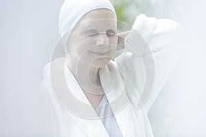Happy and smiling sick elderly woman with cancer