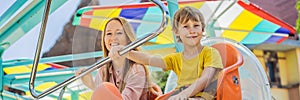 happy smiling son and his mother spending fun time together at amusement park BANNER, LONG FORMAT