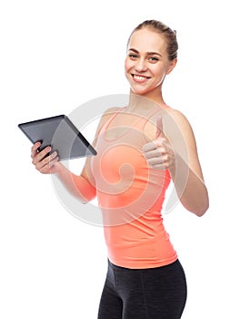 Happy smiling sportive young woman with tablet pc