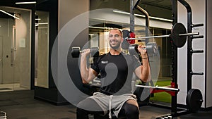 Happy smiling strong African American man lift dumbbells in gym sporty guy sport male fitness trainer instructor