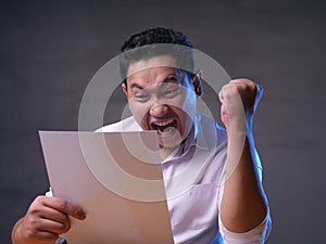 Happy Smiling Surprised Businessman Reading Positive Financial Report