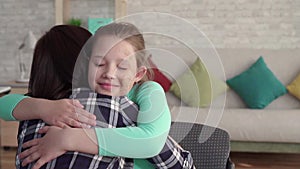 Happy smiling teen with facial defects hugging