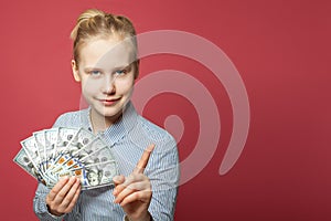 Happy smiling teen girl with money cash. Windfall, win-win and earnday concept