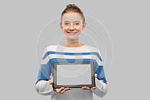 Happy smiling teenage girl with tablet computer