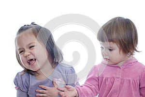 Happy smiling two little girls isolated on white background. sibling with different age communication