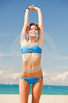 Happy smiling woman on the beach