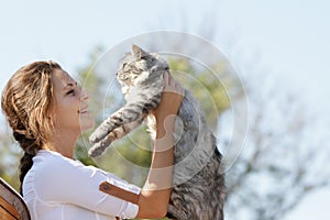 Happy smiling woman with cat