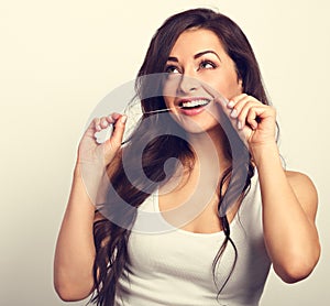 Happy smiling woman cleaning the teeth the dental floss. Dental