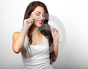 Happy smiling woman cleaning the teeth the dental floss on white