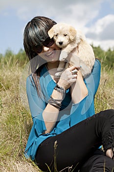 Happy Smiling Woman with Cute Puppy