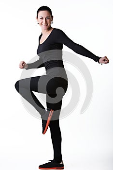 Happy smiling woman doing aerobics