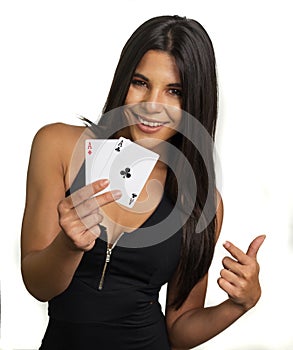 Happy smiling woman holding aces winning hand