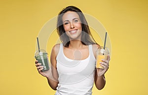 Happy smiling woman holding smoothie