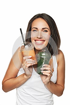 Happy smiling woman holding smoothie isolated on white