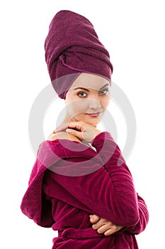 Happy smiling woman in purple bathrobe, enjoying freshness and wellbeing