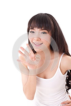 Happy, smiling woman raising, pointing her four finger up