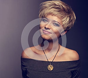 Happy smiling woman with short blond bob hairstyle in grey blous photo