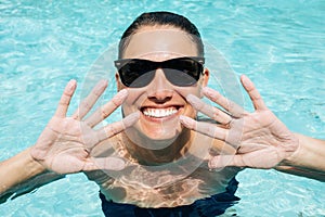 Happy smiling woman showing fingers got wrinkly