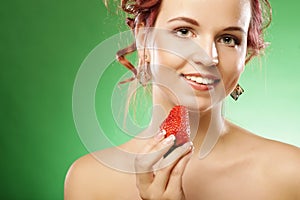 Happy smiling woman with strawberry