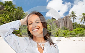 Happy smiling woman on summer beach