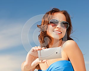 Happy smiling woman using phone camera