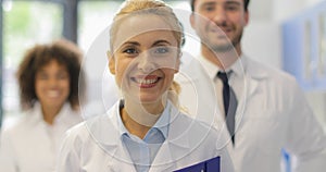 Happy Smiling Woman Walking With Team Of Doctors In Modern Laboratory Successful Researchers Group