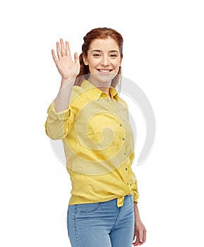 Happy smiling woman waving hand over white