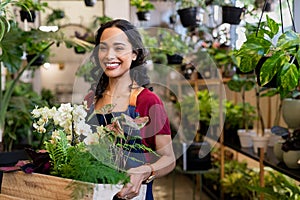 Happy smiling woman working in botany shop