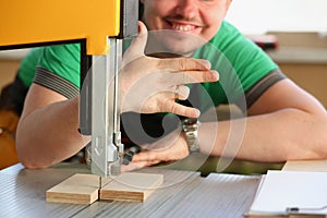 Happy smiling worker wearing yellow hard hat