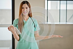 Happy smiling young beautiful female doctor