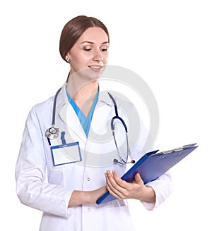 Happy smiling young beautiful female doctor showing blank area for sign or copyspace, isolated over white background