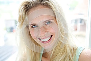 Happy smiling young blond woman