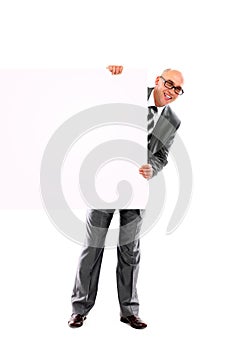 Happy smiling young business man showing blank