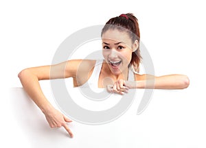 Happy smiling young business woman showing blank signboard