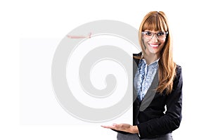 Happy smiling young business woman showing blank signboard