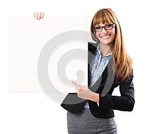 Happy smiling young business woman showing blank signboard