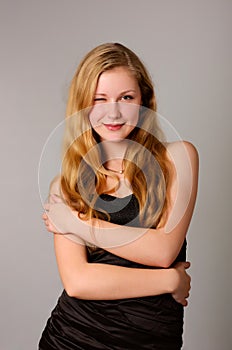 Happy smiling young girl in black dress