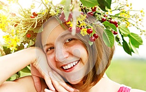 Happy smiling young girl with flower crown