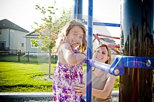 Happy smiling young girl in playground