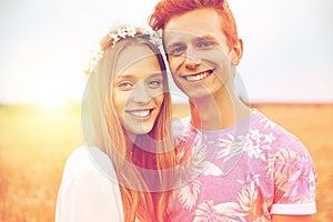 Happy smiling young hippie couple outdoors