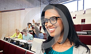 happy smiling young indian woman in glasses