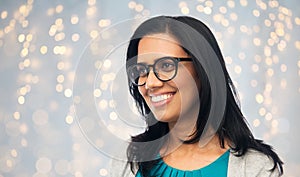 Happy smiling young indian woman in glasses
