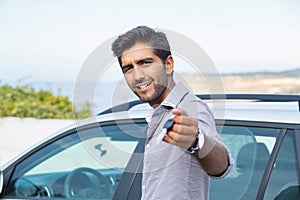 Happy, smiling, young man, buyer showing keys