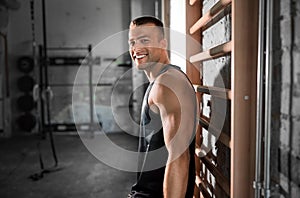 happy smiling young man in gym