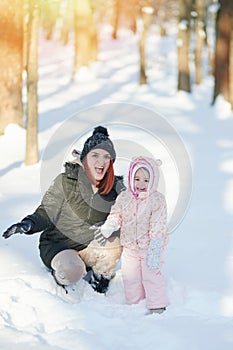 Happy smiling young mother with daughter