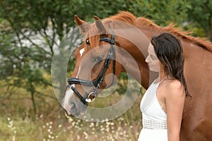 Happy smiling young woman and horse