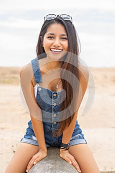 Happy smiling young woman outdoor portrait image.