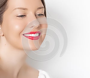 Happy smiling young woman with perfect white teeth and beautiful healthy smile, clean skin and natural makeup, female