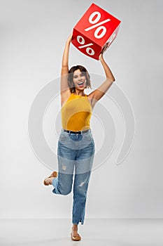 Happy smiling young woman with sale sign