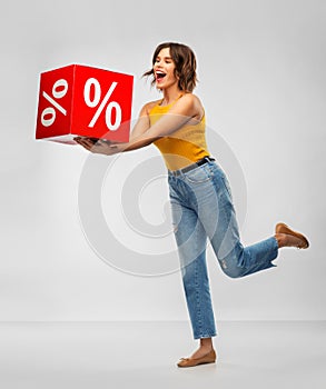 Happy smiling young woman with sale sign